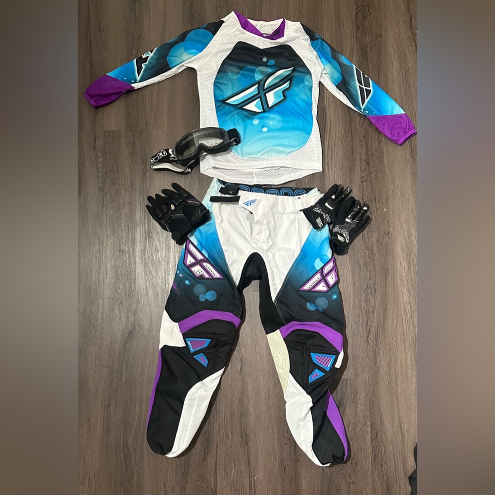 Kids blue and purple riding gear.